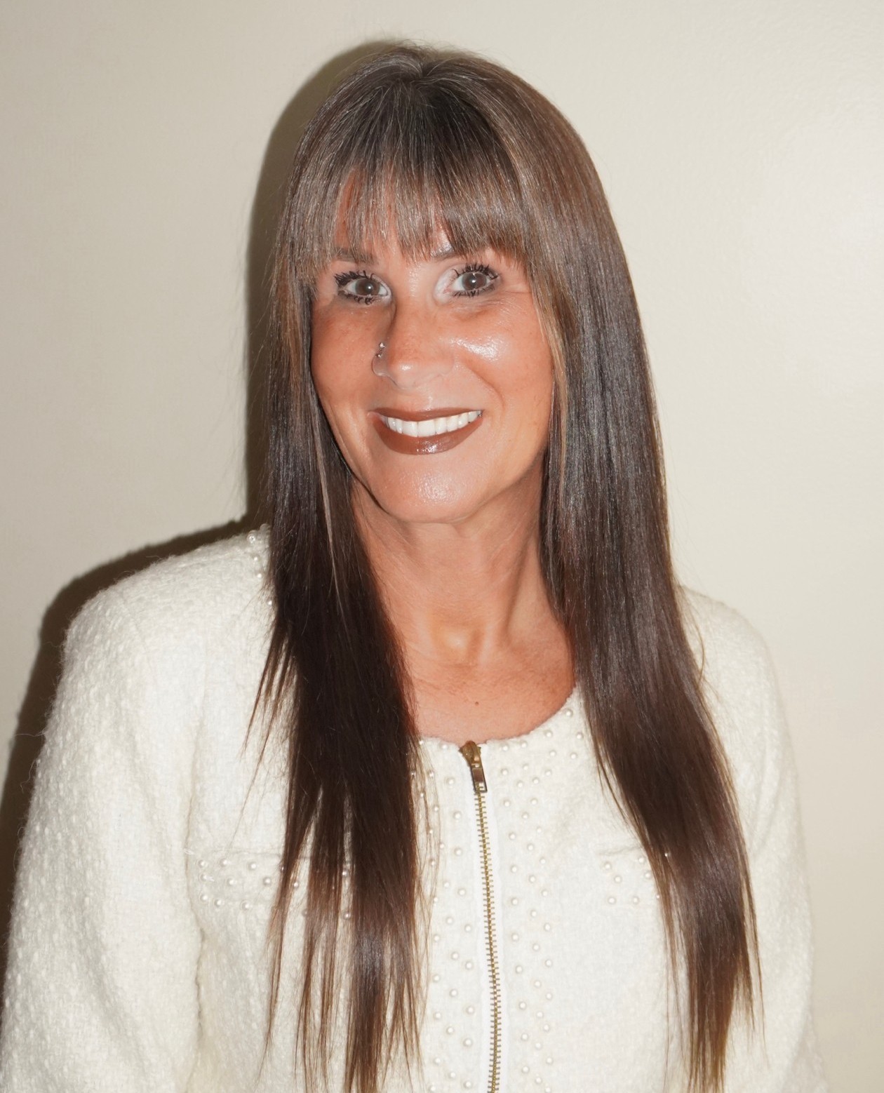 Photo of Adrienne Gilbert, hearing instrument specialist, ready to help clients find the best hearing aids for their needs.